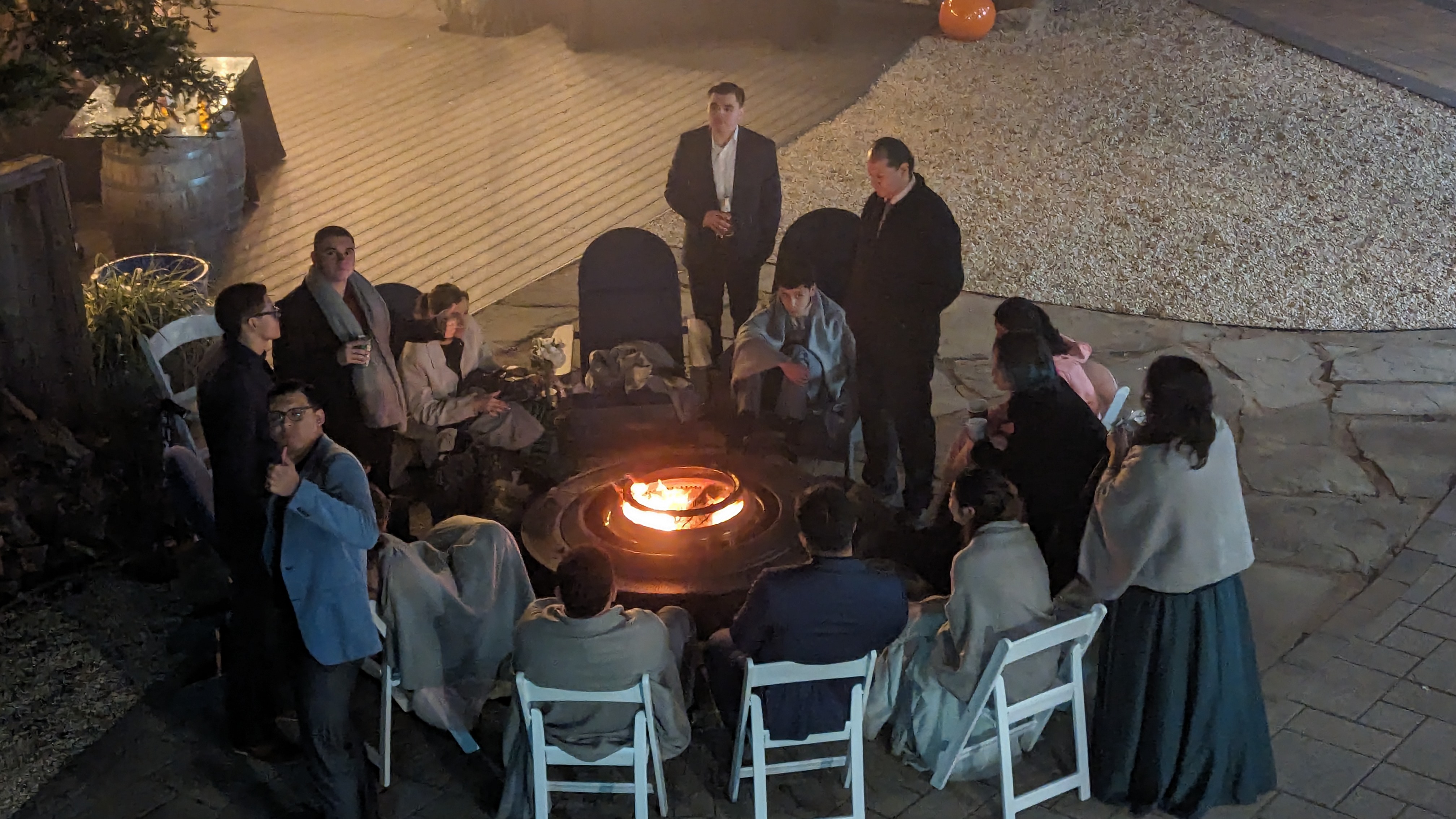Team gathered around the fire pit at Living Well Event Center, Los Gatos corporate event venue